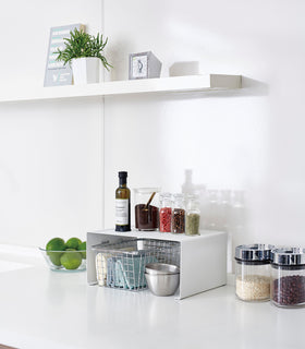 Side view of white Dish Rack holding two plates on white background by Yamazaki Home. view 26