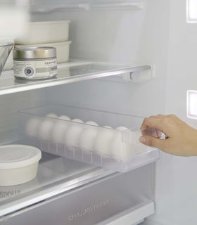 Yamazaki Egg Container for refridgerator being pulled out of a refridgerator view 12