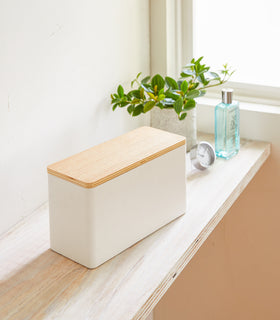 White Countertop Organizer on shelf by Yamazaki Home. view 2