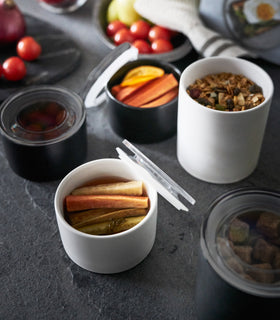 Close up aerial view of white Ceramic Canisters holding food items on kitchen counter by Yamazaki Home. view 14