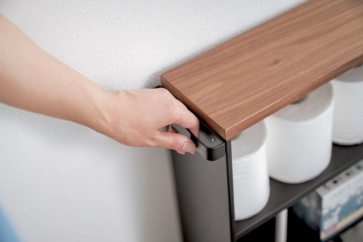 View 14 - Close up view of black Rolling Storage Cart holding toilet paper by Yamazaki Home.