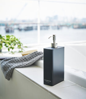 Black Shampoo Dispenser in bathroom by Yamazaki Home. view 7