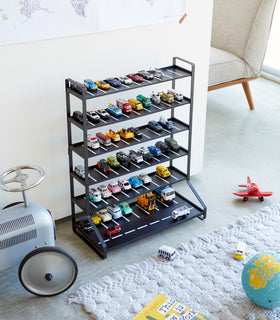 Black Kids' Parking Garage displaying toy cars in playroom by Yamazaki Home. view 9