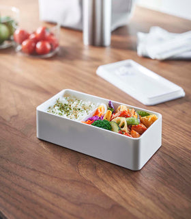 White Vacuum-Sealing Bento Box on table by Yamazaki Home. view 15