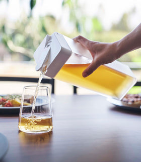 Yamazaki Horizontal Laying Water Container pouring tea into a cup view 4