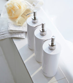 Aerial view of Yamazaki Home white Shampoo, Conditioner, and Body Soap in bathroom. view 4