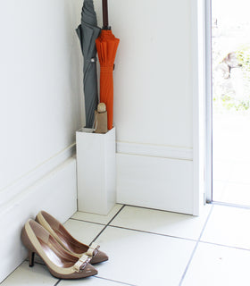 Front view of white Shoe Rack in mudroom holding shoes by Yamazaki Home. view 4