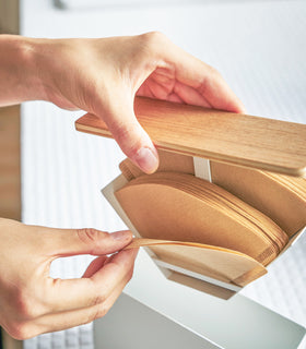 Close up aerial view of white Size 01 + 02 Wood-Accent Coffee Filter containing coffee filters by Yamazaki Home. view 5