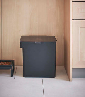 Front view of black Airtight Food Storage Container next to black Pet Food Bowl by Yamazaki Home. view 38