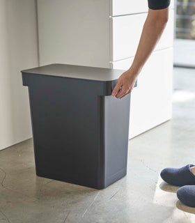 Person grabbing black Airtight Food Storage Container in kitchen by Yamazaki Home. view 14