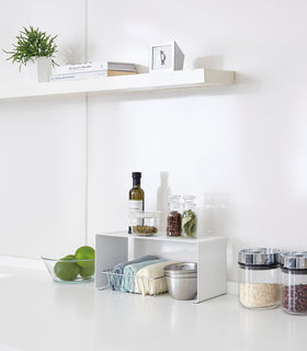 Aerial view of white Dish Rack in kitchen sink holding dinnerware by Yamazaki Home. view 2