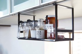 Black Under Shelf Spice Rack holding ingredients in kitchen by Yamazaki Home. view 7