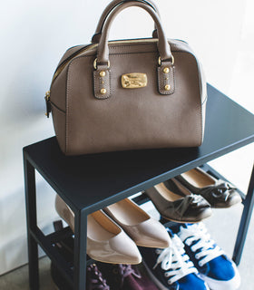 Close-up view of Black Shoe Organizer holding shoes and a purse by Yamazaki Home. view 18