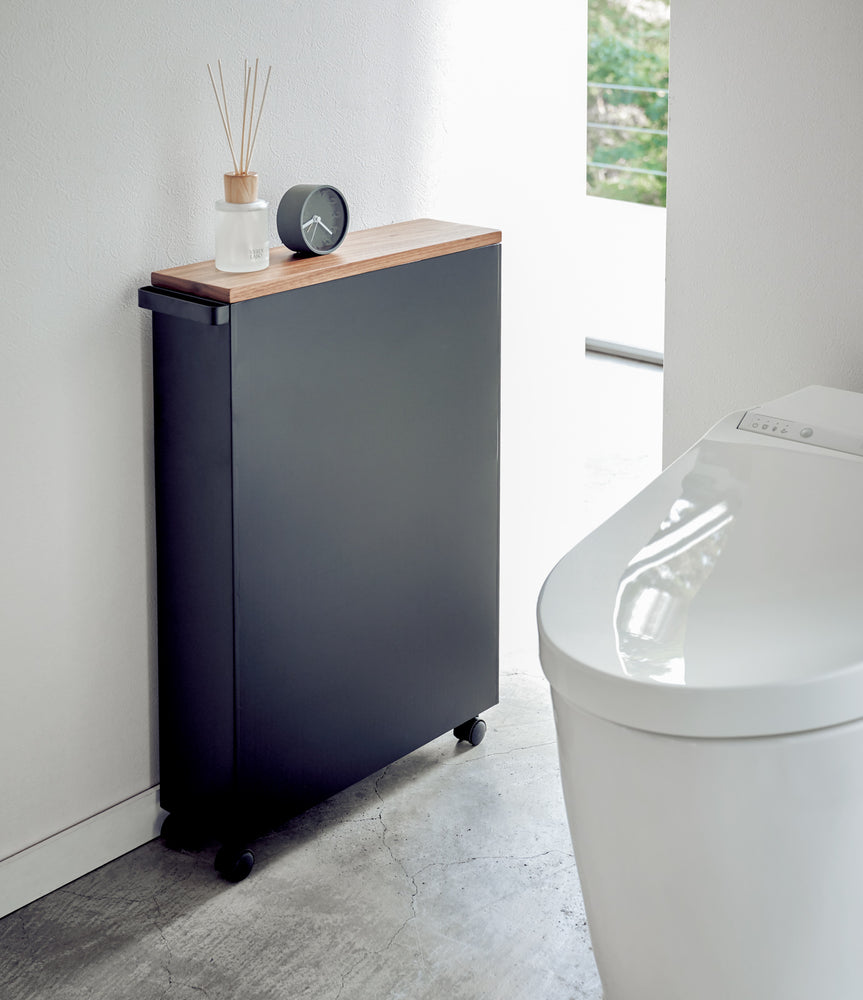 View 11 - Back view of black Rolling Storage Cart in bathroom by Yamazaki Home.