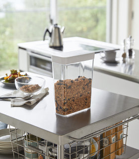 White Storage Container holding cereal on kitchen countertop by Yamazaki Home. view 3