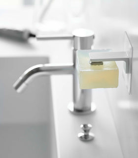 White Yamazaki Home Magnetic Soap Holder installed next to sink view 6