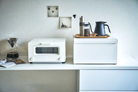 Front view of white Bread Box on kitchen shelf counter by Yamazaki Home. view 3