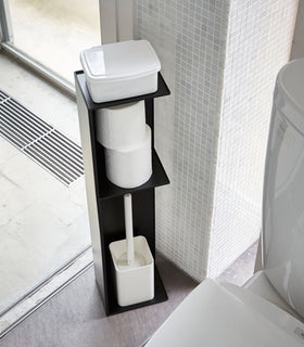 Yamazaki Home black Toilet Organizer holding toilet paper, toilet brush, and wet wipe holder in bathroom. view 7