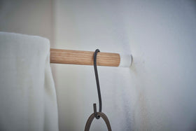 Close up of wall leaning post of Yamazaki white Corner Leaning Coat Hanger view 9