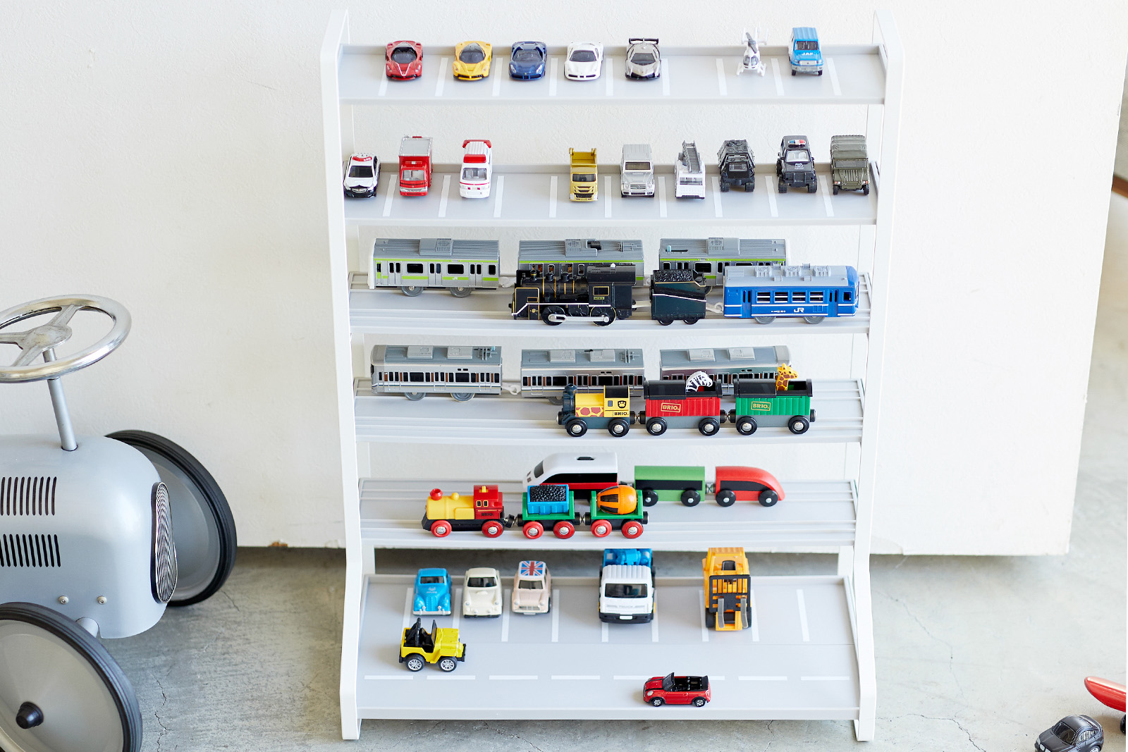 Kids' parking garage holding trains and cars. 