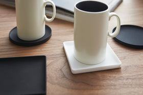 Close up view of Yamazaki Home Square Coasters holding a coffee cups. view 9