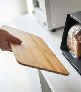 Cutting board lid taken off of black Yamazaki Bread Box with Cutting Board Lid view 15