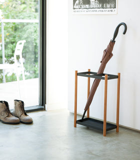 Front view of white entryway Shoe Rack holding shoes by Yamazaki home. view 2