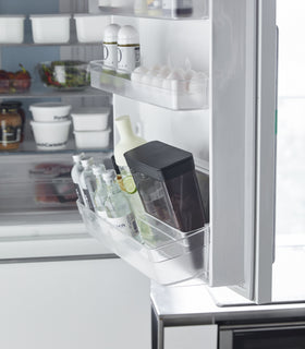 Side view of black Storage Container on kitchen fridge door by Yamazaki Home. view 11