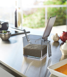 Black Pantry Organizer open holding rice on kitchen countertop by Yamazaki Home. view 19