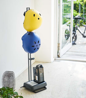 Black Kids' Helmet Stand holding helmets and bike gear by Yamazaki Home. view 7