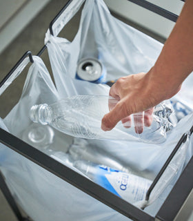 Aerial view of black Rolling Trash Sorter holding plastic bottles and plastic bag by Yamazaki Home. view 10