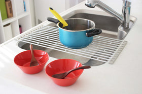 Side view of White Over the Sink Folding Drying Rack holding pot on drying rack.
 view 6