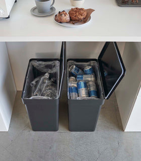 Aerial view of two black Rolling Trash Cans side by side holding recyclables in kitchen by Yamazaki Home. view 12