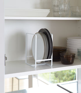 White Dish Storage Rack holding plates in kitchen by Yamazaki Home. view 2