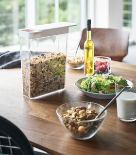 White Storage Container on holding cereal on kitchen table by Yamazaki Home. view 4