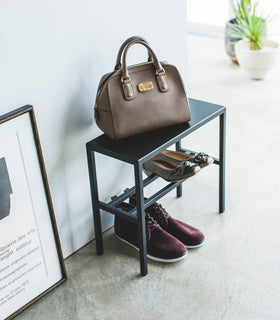 Side view of Black Shoe Organizer holding shoes and a purse by Yamazaki Home. view 14