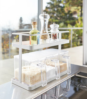 White Undershelf Organizer holding cooking ingredients by Yamazaki Home. view 12