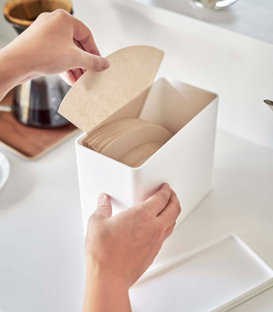 View 6 - Taking out coffee filters from white Yamazaki Home kitchen storage box