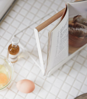 White Tablet and Cookbook Stand holding cookbook by Yamazaki home. view 7