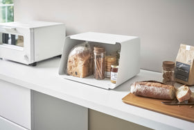 White Yamazaki Bread Box with Cutting Board Lid open with bread and jam inside view 6