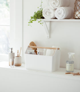 Front view of white Storage Caddy in bathroom by Yamazaki Home. view 4