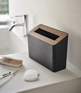 Black Countertop Waste Bin on bathroom sink counter by Yamazaki Home. view 8