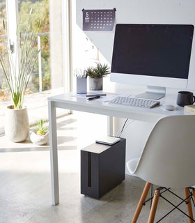 Black Rolling Cable Management Rack under desk in office by Yamazaki Home. view 10