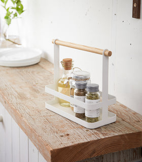 Countertop Storage Caddy displaying oils and spices on counter by Yamazaki Home. view 3