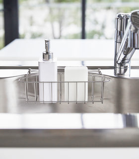 Front view of white Hand Soap Dispenser in kitchen sink by Yamazaki Home. view 5