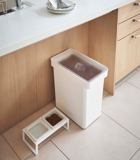 Aerial view of white Airtight Food Storage Container holding pet food next to Pet Food Bowl in kitchen by Yamazaki Home. view 2