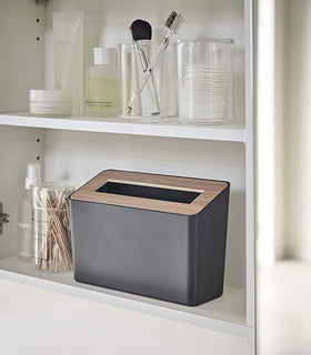 Front view of black Countertop Waste Bin on bathroom shelf by Yamazaki Home. view 9