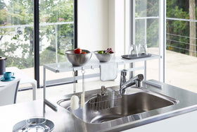 Front view of white Dish Rack holding plates, cups, and silverware on kitchen counter by Yamazaki Home. view 5