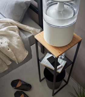 Top-down view of Yamazaki black Pedestal Stand with an air purifier resting on top view 16