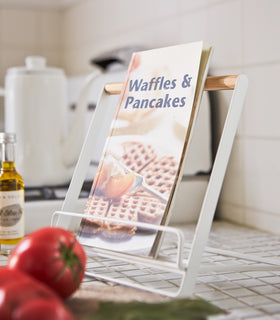 Close up view of Tablet and Cookbook Stand holding recipe book on kitchen counter by Yamazaki Home. view 8